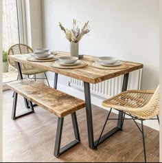 a dining table with two chairs and a bench