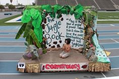 the jungle book is on display in front of an empty basketball court with palm trees