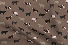 a brown and black cow pattern on a tan background