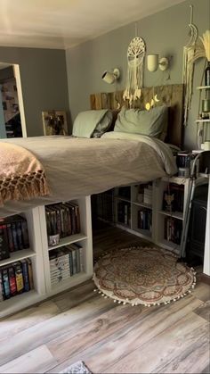 a bedroom with a bed, bookshelf and rugs on the floor in front of it