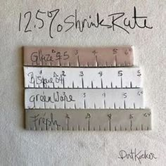 three rulers are shown with writing on them