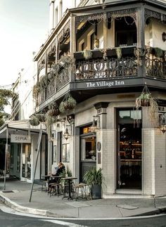 the village inn is located in an old building with balconys and balconies