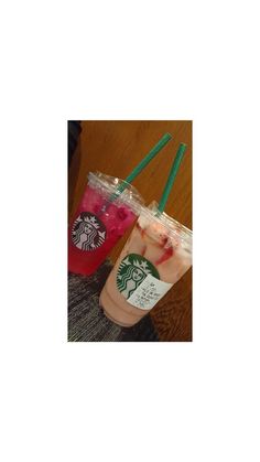 two starbucks drinks with strawberries in them