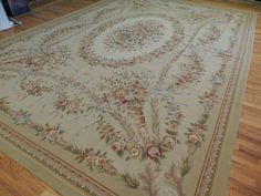 a large rug is on the floor in a room