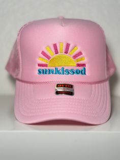 Embroidered "Sunkissed" Pink Trucker Hat Trendy Summer Trucker Hat With Embroidered Logo, Trendy Embroidered Trucker Hat For Summer, Trendy Embroidered Trucker Hat, Trendy Embroidered Beach Hat, Summer Visor Trucker Hat, Trendy Trucker Hat With Embroidered Logo For Spring, Trendy Trucker Hat With Uv Protection Snapback, Trendy Snapback Trucker Hat With Uv Protection, Trendy Summer Baseball Cap With Embroidered Logo