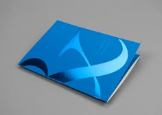 a blue business card sitting on top of a table