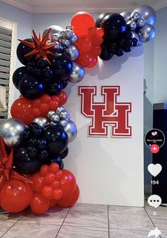 balloons are arranged in the shape of letters and stars on display at a university event