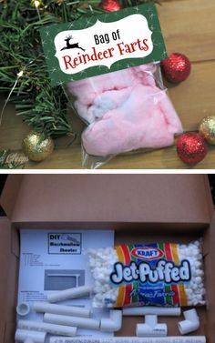 an open box filled with candy and marshmallows next to a christmas ornament