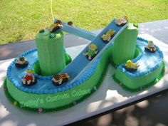 a birthday cake that is shaped like a slide