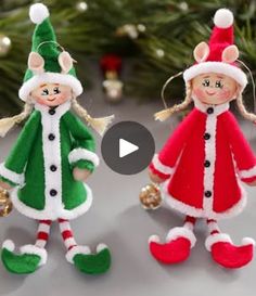 two christmas elves are standing next to each other