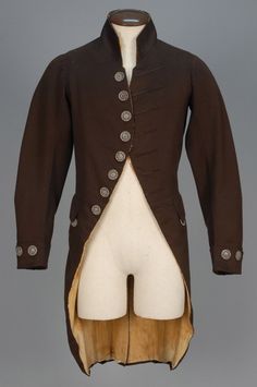 ENGLISH WOOL LIVERY COAT, 1790 - 1800. Brown broadcloth cutaway having cut steel buttons, corded false buttonholes, button decorated shaped pocket flaps, cuffs and deep back vent, silk lining. Regency Mens Fashion, Tail Coat, F Men, Dark Clothes