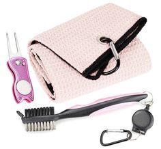 a pink purse, hair brush, scissors and comb