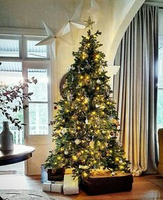 a decorated christmas tree in a living room