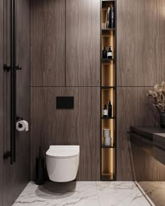 a toilet sitting next to a wooden shelf filled with bottles and other items in a bathroom