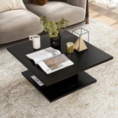 a living room with a couch, coffee table and vases on the carpeted floor