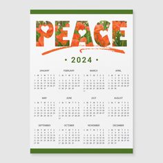 a calendar with the word peace written in orange and green on top of it, next to an image of red poppies