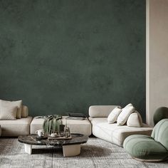 a living room filled with lots of furniture and green wall paint on the walls behind it