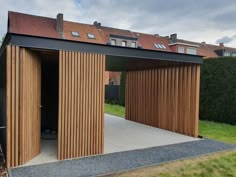 an open garage with wooden slats on the roof