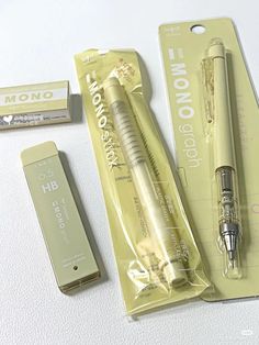 an unopened pen and its packaging on a white surface with other items around it