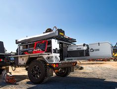 an off road utility vehicle parked in the dirt