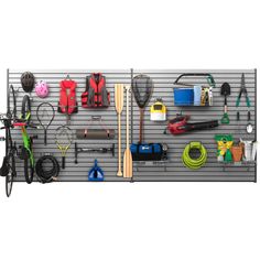 a wall mounted tool rack filled with tools