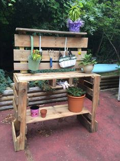 a potted plant sitting on top of a wooden shelf next to a bench filled with plants