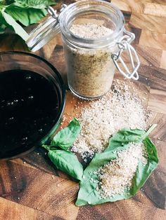 there is a jar with some sort of food in it on the table next to other items