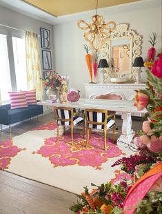 a living room filled with furniture and flowers on the floor in front of a mirror