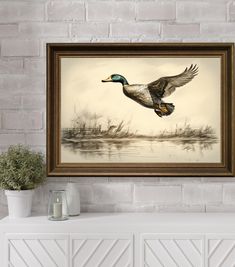 a duck flying over a body of water in front of a brick wall with a potted plant