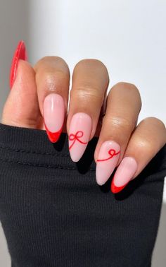 Get inspired by 30+ adorable bow nail designs, from cute 3D bow nails to short and sweet styles in pink, red, white, gold, and black. This also includes coquette nails, ribbon nails, short bow nails, french tip bow nails, bow nail art. (📷 pearliepressed IG) Nail Art Design French Tip, Nail Inspo Simple Christmas, Red Nails Pink Bow, Red And Pink Bow Nails, Pink And Red French Manicure, Birthday Holiday Nails, Almond Nails Bow Design, Christmas Pink And Red Nails, How To Do Bows On Nails