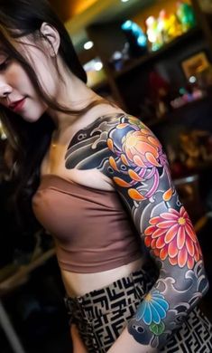 a woman with a tattoo on her arm