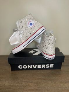 "Custom decorated converse shoes in varying sizes of white pearls and crystals. These shoes are dressed up with hand placed stones and/or pearls on a pair of high top shoes. Bling shoes are custom made to order and no 2 sets are exactly alike. Price includes shoes and materials, shoes come completely done and ready to wear. Customize your converse with specific requests (bows, rhinestones, tulle, charms etc), your favorite color, specific color scheme, just list the details in the customization White Converse Wedding, Decorated Converse, Rhinestone Converse, Bling Sneakers, Converse Wedding, Bedazzled Shoes, Valley Cottage, Wedding Converse, Shoes Bride