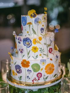 3-tier wedding cake with orange, yellow, and blue pressed flowers. Pressed Flower Cake, Mindy Weiss, Bridal Trends, Spring Weddings, Greek Wedding, Kay Jewelers, Garden Theme, Dreamy Wedding, Pressed Flower