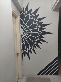 the wall is painted with black and white designs