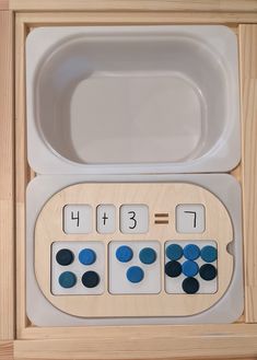 a wooden box with buttons in it