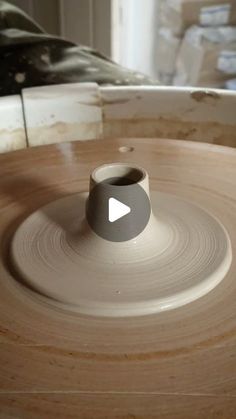 a pottery wheel spinning on top of it