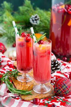 two glasses filled with cranberry punch on top of a table