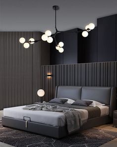 a bed sitting in the middle of a bedroom next to a wall with lights on it