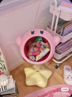 there is a pink bear shaped sink in the corner of this room with toys and other items