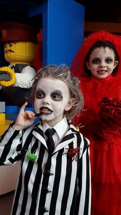 two children dressed up in costumes for halloween