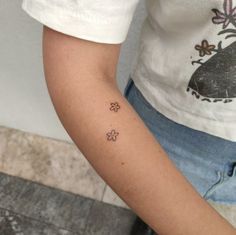 a person with a small tattoo on their arm