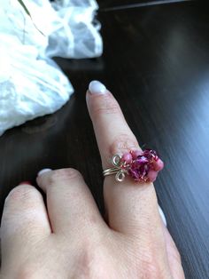 Handcrafted wire wrapped ring! Pink Wire Wrapped Jewelry For Jewelry Making, Unique Wire Wrapped Jewelry Ring, Adjustable Beaded Wire Jewelry, Beaded Toe Ring Jewelry As Gift, Beaded Rings For Jewelry Making, Pink Bohemian Rings For Jewelry Making, Unique Wire Wrapped Promise Ring, Unique Hand Wrapped Pink Jewelry, Gift Beaded Jewelry With Silver Plated Wire