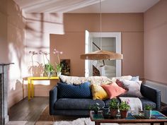 a living room filled with furniture and a fire place