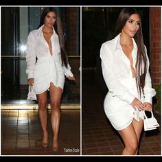 a woman in white shirt dress and heels walking down the street with her hand on her hip