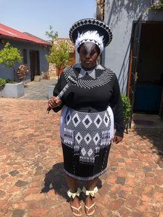 Immerse yourself in the rich culture of the Zulu people with this magnificent 8-piece black and white ensemble. This set includes a beautifully designed Zulu hat, an elegant beaded necklace, matching earrings, traditional gloves, a flowing skirt, a detailed apron, a beaded knobkerrie stick, and a unique leg piece filled with sand that emits sound as you move. Perfect for traditional ceremonies, weddings, or cultural celebrations, this collection combines authentic craftsmanship with bold, timeless design. Black and White Zulu Hat: Handcrafted in a striking black and white pattern, this traditional hat is a true symbol of Zulu pride and style. Beaded Necklace: The necklace is intricately adorned with black and white beads, creating a stunning, eye-catching piece that complements the entire Zulu Hat, Elegant Beaded Necklace, Beaded Gloves, Zulu Women, Skirt Apron, Traditional Skirts, Necklace Matching, Cultural Celebration, Flowing Skirt