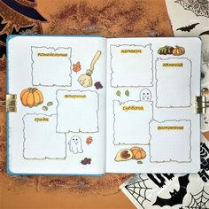 an open halloween planner with pumpkins, ghostes and other things on it's pages