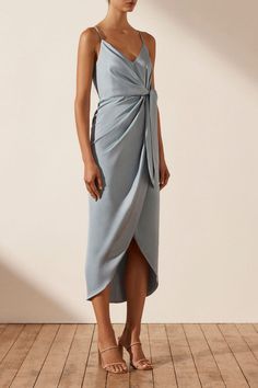 Tie front draped cocktail dress in a light weight recycled polyester with a smooth, lustrous finish. Recycled polyester gives a second life to materials that would otherwise end up in landfill or the ocean, and production of recycled polyester also generates less energy and fewer CO2 emissions which helps promote our commitment towards becoming a more responsible and circular brand. Azure Dress, High Neck Midi Dress, One Shoulder Cocktail Dress, Shona Joy, Ruched Midi Dress, Slim Fit Top, Midi Length Skirts, Midi Dress With Sleeves, Second Life