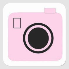 a pink camera sticker with a black circle on the front and white border around it