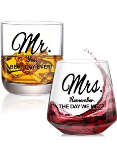 two wine glasses with the words mr and mrs on them, one is filled with red liquid