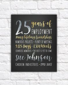 the 25 years of employment sign is hanging on a brick wall in front of a white brick